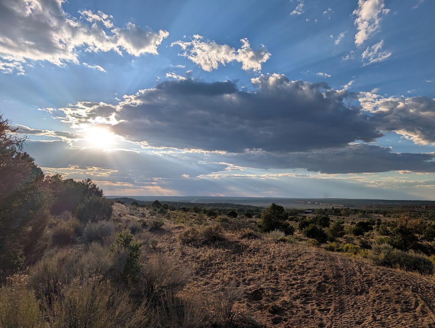 Sun rays breaking through cloud over the valley